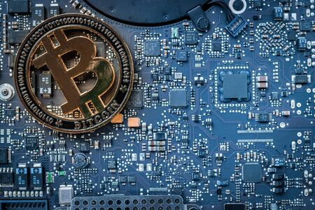 Bitcoin wallet. Gold Cryptomoney Computer electronic circuit board motherboard. Litecoin, Ethereum Cryptocurrency Technology Background concept.の写真素材