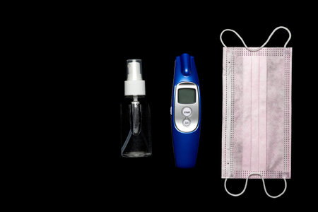 Sanitizer bottle, Medical surgical mask, modern thermometer and lab gloves - Virus protection...