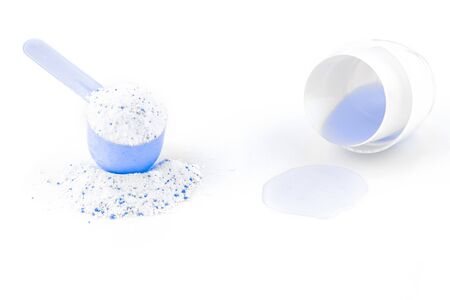 Detergent shirt. Soap texture with scoop. Liquid powder in cup for washing machine isolated on white. Laundry wash clothes background. Eco style cleaning concept.の写真素材