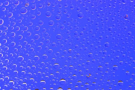 Drops background. Wet water on glass. Rain pattern texture