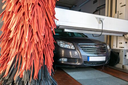 Wash car. Carwash service with water, soap. Hand clean vehicle auto from foam. Automatic care, waxing.の写真素材