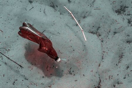 Sea plastic garbage trash on marine ocean beach. Waste rubbish in environment and water. Ecological problem with Empty used bottles of big city.の写真素材