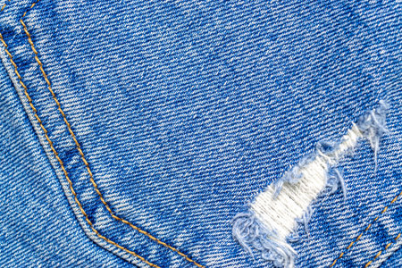 Jeans texture. Blue denim textile pattern in close up. Indigo cl