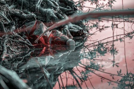 Save water. Rubbish trash, plastic waste in sea beach, marine ocean and garbage in environment. Empty used dirty bottles in the concept of nature conservation from pollution.の写真素材