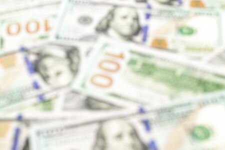 Money stack soft focus. 100 Hundred dollars of USA. American paper cash abstract blur background, usd bill.の写真素材