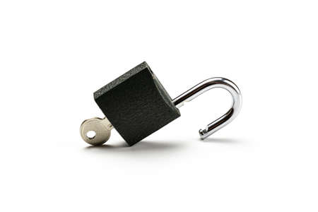 Key isolated. Metal lock pad or padlock on white background. Privacy security concept.の写真素材