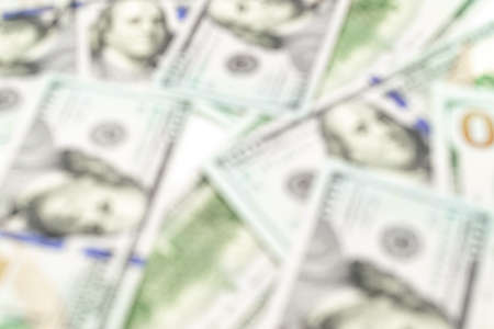 Us dollar abstract blur background. American USA money, 100 hundred paper cash in soft focus, usd billの写真素材