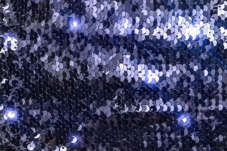 Sequins background. Glitter blue fabric texture. Colorful mermaid sequins isolated