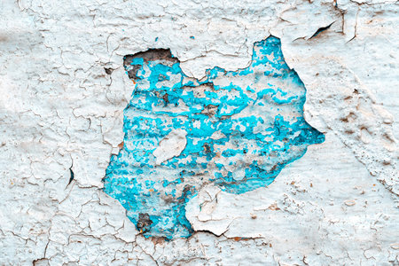 Peeling wallpaper. Old rough stone on cement pattern wall background. Vintage grunge plaster or...