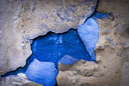Peeling wall paint. Vintage grunge plaster or concrete stucco surface. Old rough stone on cement pattern wall background. Montage product design conceptの写真素材