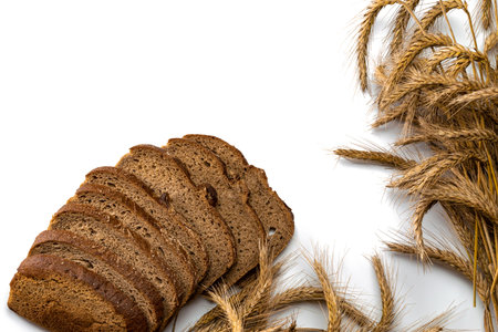 Rye bread isolated. Bakery with crusty loaves and crumbs. Fresh loaf of rustic traditional bread...