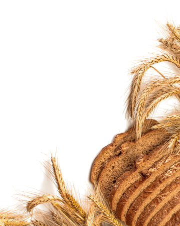 Rustic rye. Fresh loaf of rustic traditional bread with wheat grain ear or spike plant isolated on...