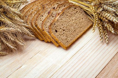 Bakery products. Rye bakery with crusty loaves and crumbs. Fresh loaf of rustic traditional bread...