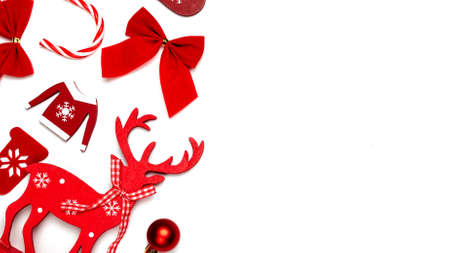 Christmas wreath. Stocking, gifts, winter tree, ribbon and bow in shape frame on white background for greeting card. Xmas backdrop with space for textの写真素材