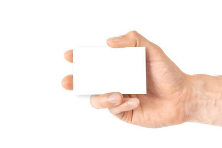 Hand holding card. Hand holding blank business paper card isolated on white background. Empty credit template in person armの写真素材