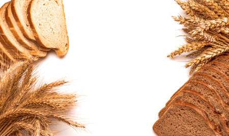 Rustic rye. Fresh loaf of rustic traditional bread with wheat grain ear or spike plant isolated on white background. Bakery with crusty loaves and crumbs. Design element for bakery product labelの写真素材