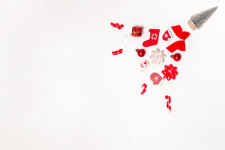 Christmas background. Stocking, gifts, winter tree, ribbon and bow in Christmas composition on white...