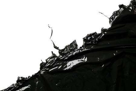 Plastic bag texture. Wrap transparent dark cellophane isolated on white background with copy space. Black shiny film pattern for packaging, product protectionの写真素材