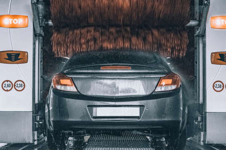 Hand clean car. Auto wash from soap, foam water service, carwash vehicle.の写真素材