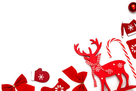 Xmas decoration. Stocking, gifts, winter tree, ribbon and bow in shape frame on white background for greeting card. Decoration and copy space for your textの写真素材