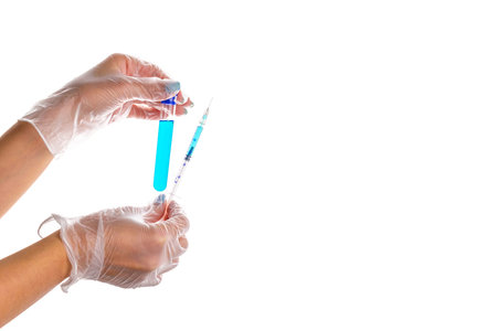 Vaccine development. Doctor hand in medical glove hold test tube or bottle for protection flu virus...