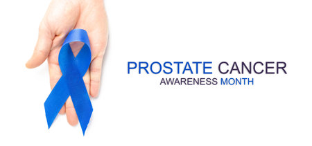 Cancer men. Awareness prostate cancer of men health in Movember. Blue ribbon in hands isolated on white background. Supporting people living and illnessの写真素材