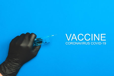 Vaccination bottle. Doctor hand in medical glove hold syringe with needle for protection flu virus...