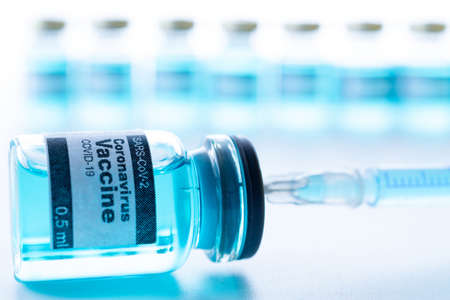 Vaccine isolated. Medical syringe with needle for protection flu virus and coronavirus. Covid immunization isolated on white. Concept fight against virus covid-19の写真素材