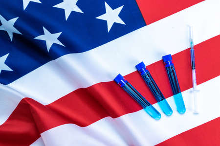 Medical needles. Medical syringe with needle for protection flu virus vaccine usa flag of america.の写真素材