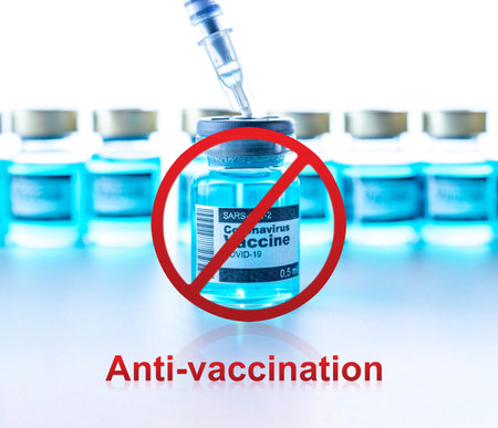 Anti-vaxxers. Anti Covid vaccine isolated on white. Red forbidden sign with Medical syringe, needle for protection flu virus. Medicine concept vaccination hypodermic injection treatmentの写真素材