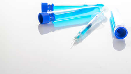 Cancer virus. Medical syringe with needle for protection flu virus .  vaccine on white. Medicine concept vaccination hypodermic injection treatmentの写真素材