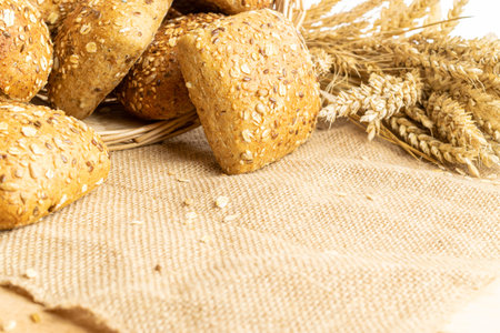 Home baked bread. Rye bakery with crusty loaves and crumbs. Fresh rustic traditional bread with...