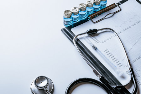 Covid vaccination. Healthcare medical infographic, doctor health stethoscope and analysis vaccination statistics on hospital background. Research data economy spreadsheet, business company conceptの写真素材