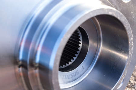 Part isolated. Set of new metal car part. Auto motor mechanic spare or automotive piece isolated on black ground asphalt texture. Tarmac dark gray grainy roadの写真素材