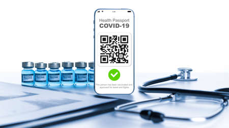 Health certificate. Medical equipment with Coronavirus vaccine certificate on phone screen, healthcare charts, syringe and doctor stethoscope on hospital white background. Digital passport conceptの写真素材