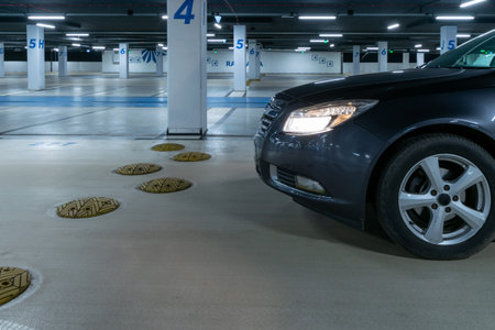 Garage interior. Car lot parking space in underground city garage. Empty road asphalt background. Large private garageの写真素材