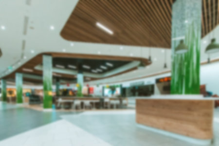 People shopping center blurred background. Interior of retail center store in soft focus. People...