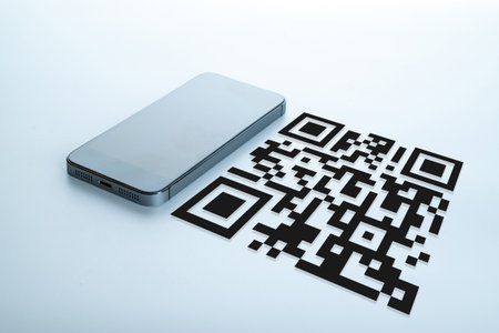 Qr code technology. Mobile smartphone screen for payment, online pay, scan barcode technology with qr code scanner on digital smart phone. Hands using mobile phone application to scan code.の写真素材