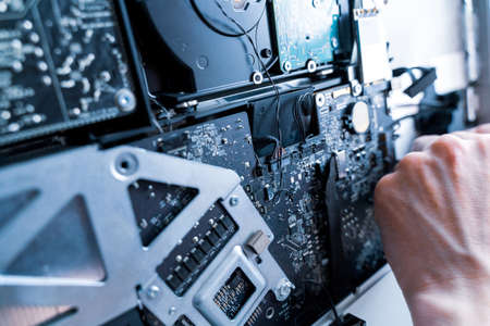 Repair computers. Technology maintenance hardware from man engineer. Electronic technician pc serviceの写真素材