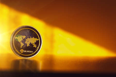 Monero business. Gold Crypto currency BTC Bitcoin on black background. Golden Bit Coin virtual cryptocurrency or blockchain technology. Virtual money and mining conceptの写真素材