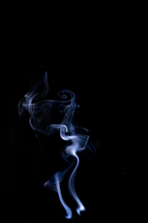 Isolated steam. Blur steam mist cloud, abstract fog or white smoke isolated on black background. Abstract of steam with copy spaceの写真素材