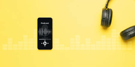 Podcast icon. Audio equipment with microphone, sound headphones, podcast application on mobile smartphone screen. Radio recording sound voice on yellow background. Broadcast media music conceptの写真素材