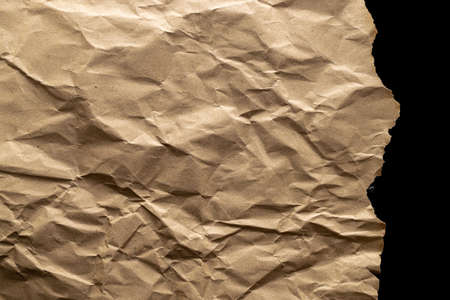 Ripped craft paper. Torn kraft paper texture background. Old craft vintage cardboard isolated on black with clipping pathの写真素材
