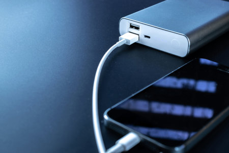 Phone power bank. Mobile phone or smartphone battery charging from portable powerbank with white usb...