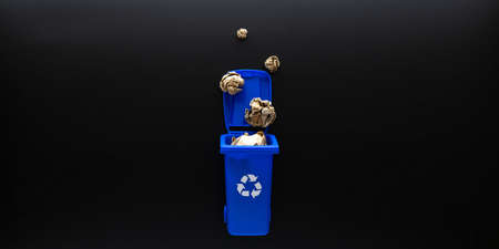 Precycling paper. Bin container for disposal garbage waste and save environment. Blue dustbin for recycle paper trash on black background. Flat layの写真素材