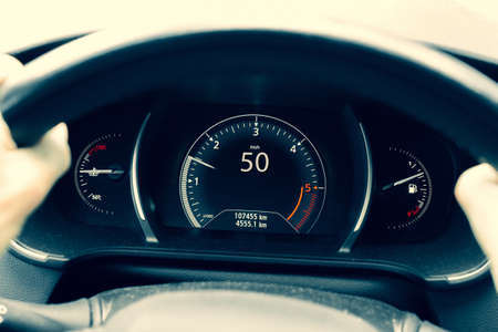 Speed car. Speedometer, tachometer on vehicle dashboard panel. Fast car interiorの写真素材