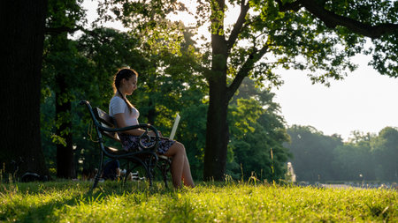 Laptop outdoor business technology. Student girl person work on tablet, computer in summer park....