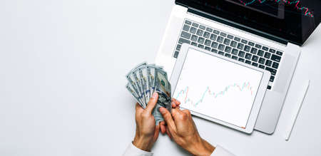 Forex trading. Investment business technology app on digital screen. Finance application for sell, buy and analysis profit dividend statistics. Investment strategy flat lay bannerの写真素材
