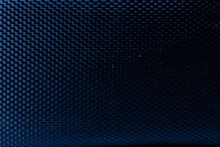 Mesh black texture. Dark polyester fiber material for sport cloth or abstract weave background....