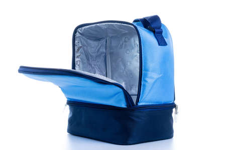 Blue bag. Camping freezer, cooler box for cold lunch food isolated on white background. Blue bag for travel, picnicの写真素材